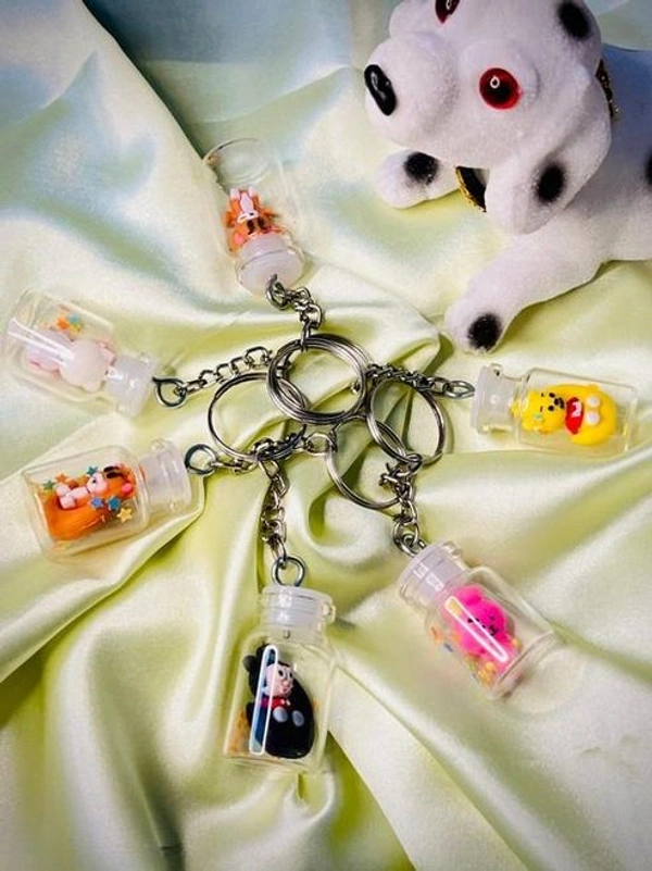 Cute Mini Bottle Keychains – Cartoon Character Charms for Bags & Keys - Random Cartoon (Pack Of 3)