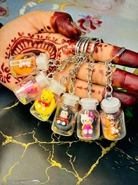 Cute Mini Bottle Keychains – Cartoon Character Charms for Bags & Keys - Random Cartoon (Pack Of 3)