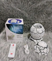 Dinosaur Egg Star Projector Night Light With Bluetooth Speaker