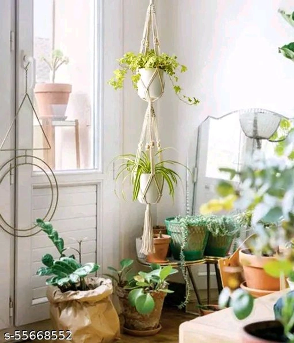 Macrame PCENFAP014 Multi Plant Pot Hanger, 2 TierName: Macrame Multi Plant Pot Hanger, 2 TierMaterial: FabricShape: ContemporaryType: HangingProduct Breadth: 6 InchProduct Height: 52 InchProduct Length: 6 InchNet Quantity (N): Pack Of 1Plant pot holder made in cotton macrame. - Brown