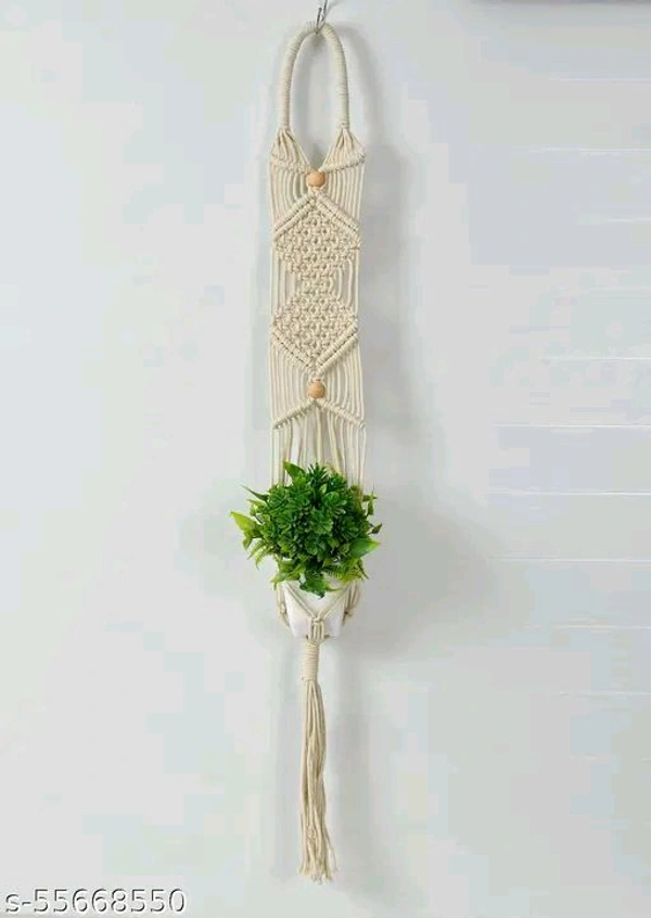 Macrame PCENFAP014 Multi Plant Pot Hanger, 2 TierName: Macrame Multi Plant Pot Hanger, 2 TierMaterial: FabricShape: ContemporaryType: HangingProduct Breadth: 6 InchProduct Height: 52 InchProduct Length: 6 InchNet Quantity (N): Pack Of 1Plant pot holder made in cotton macrame. - Brown