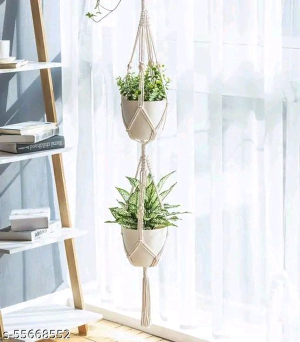 Macrame PCENFAP014 Multi Plant Pot Hanger, 2 TierName: Macrame Multi Plant Pot Hanger, 2 TierMaterial: FabricShape: ContemporaryType: HangingProduct Breadth: 6 InchProduct Height: 52 InchProduct Length: 6 InchNet Quantity (N): Pack Of 1Plant pot holder made in cotton macrame. - Brown