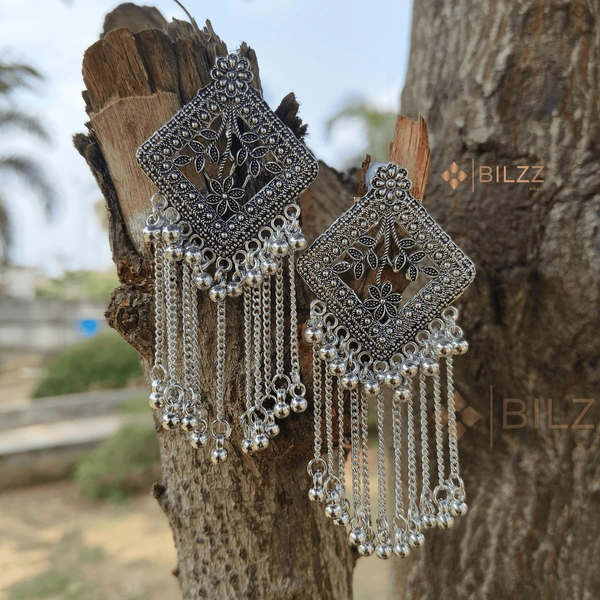 Shiny Silver Jhumka Earrings: Traditional Treasures