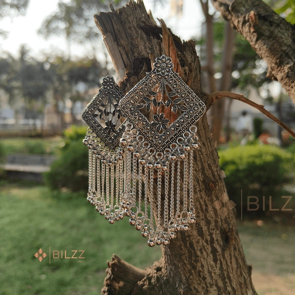 Shiny Silver Jhumka Earrings: Traditional Treasures