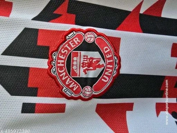 "Show your Red Devils pride with this classic Manchester United jersey. Featuring premium fabric and authentic detailing, it's perfect for match days or everyday wear. A must-have for every true fan. COD & pan-India shipping available!" - Black, XXL