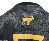 This premium black Portugal jersey with gold accents honors Cristiano Ronaldo. Featuring a GOAT emblem, number 7, and CR7 branding, it’s a sleek and powerful tribute to a football legend. - Black, XXL