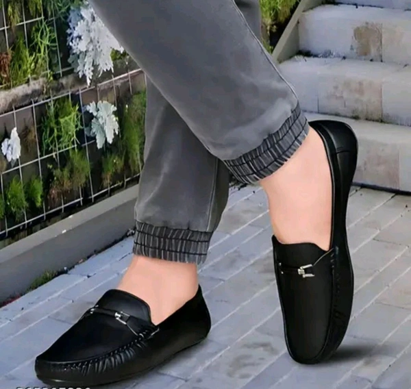 NEW TRENDY BLACK LOAFER
Name: NEW TRENDY BLACK LOAFER
Material: Synthetic
Sole Material: Pvc
Fastening: Slip On
Toe Shape: Round Toe
Net Quantity (N): 1
M.D. Loafer shoes are so comfortable shoes and wearing them looks very good.
Sizes: 
IND-6 (Foot Length Size: 25 cm, Foot Width Size: 10 cm) 
IND-7 (Foot Length Size: 26 cm, Foot Width Size: 10.1 cm - 7