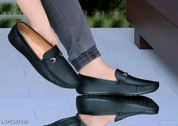 NEW TRENDY BLACK LOAFER
Name: NEW TRENDY BLACK LOAFER
Material: Synthetic
Sole Material: Pvc
Fastening: Slip On
Toe Shape: Round Toe
Net Quantity (N): 1
M.D. Loafer shoes are so comfortable shoes and wearing them looks very good.
Sizes: 
IND-6 (Foot Length Size: 25 cm, Foot Width Size: 10 cm) 
IND-7 (Foot Length Size: 26 cm, Foot Width Size: 10.1 cm - 8
