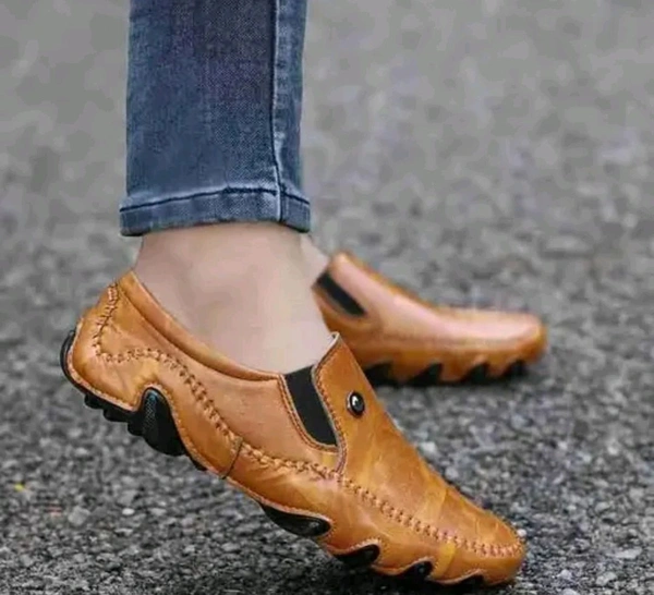 AKIKO GB Loafers - TAN
Name: AKIKO GB Loafers - TAN
Material: Synthetic
Sole Material: Rubber
Fastening: Slip On
Toe Shape: Round Toe
Net Quantity (N): 1
Sizes: 
IND-6 (Foot Length Size: 25.4 cm, Foot Width Size: 10 cm) 
IND-7 (Foot Length Size: 26 cm, Foot Width Size: 10 cm) 
IND-8 (Foot Length Size: 27.3 cm, Foot Width Size: 10 cm) 
IND-9 (Foot Length Size: 27.9 cm, Foot - 9
