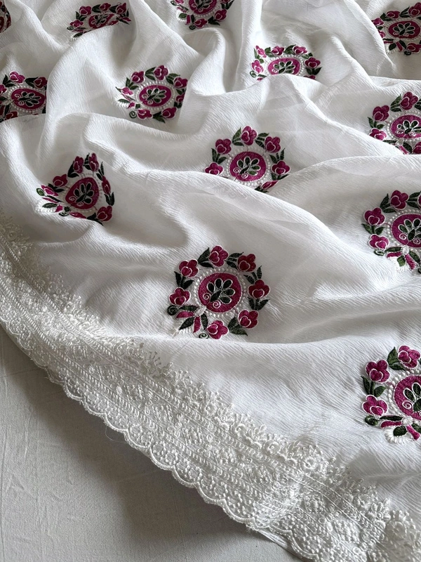 Pure crush Georgette chiffon  Saree with premium floral embroidery all over the Saree with scallop embroidery Border
Blouse:- contrast lucknowi Sequence embroidery blouse.